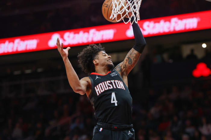 Rockets guard Jalen Green (4) grabs a rebound against the Atlanta Hawks in the first quarter at State Farm Arena.